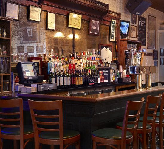 The bar at Finnegan's restaurant and taproom getting ready for happy hour