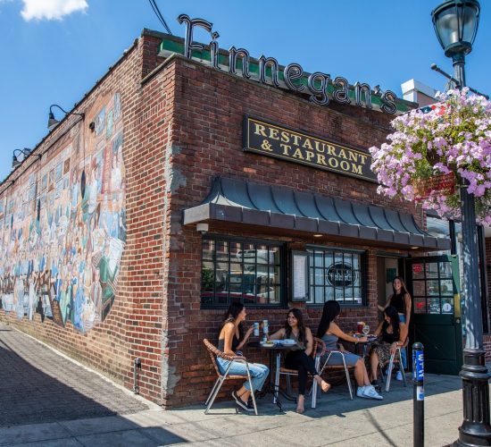 People dining outside Finnegan's, the best restaurant and taproom in town